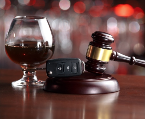 drink, gavel and car keys